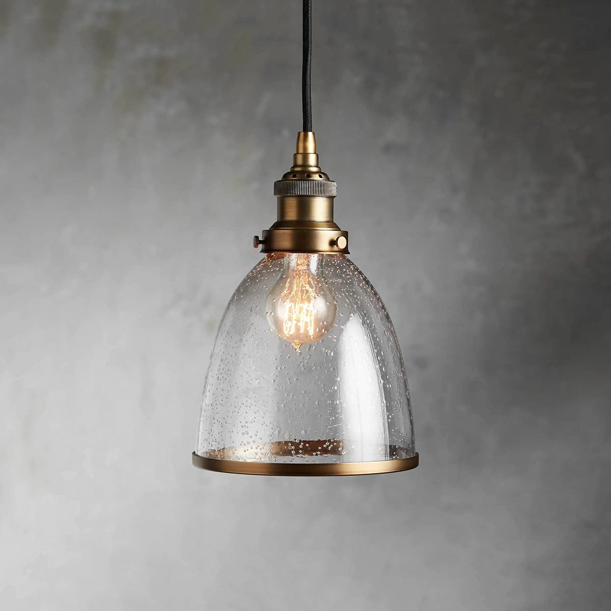 Thea antiqued brass cloche pendant with seeded glass